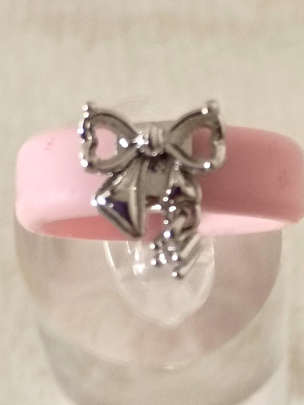 Size 8 Women’s Pink Silicone Ring with Silver Bow Charm